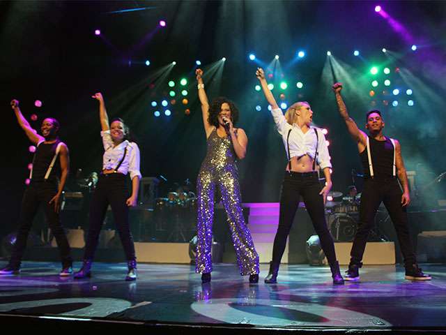 PHOTO-Whitney-Belinda-and-Dancers-Fists-Up-Green-Front-ShotIMG_2134.jpg